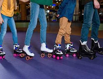 kids roller skating together at the skate rink